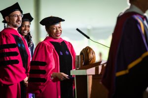 Dean Eboni Nelson smiles at graduates