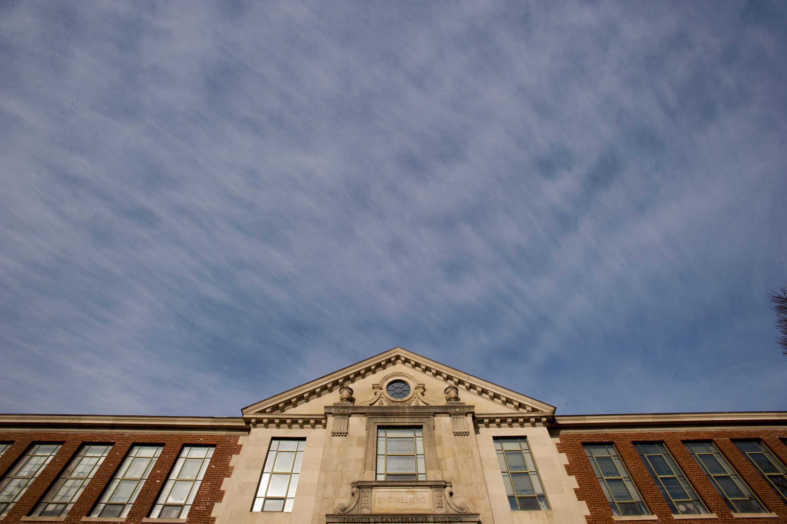 The front exterior of the Castleman Building, shown under a cloudy sky.