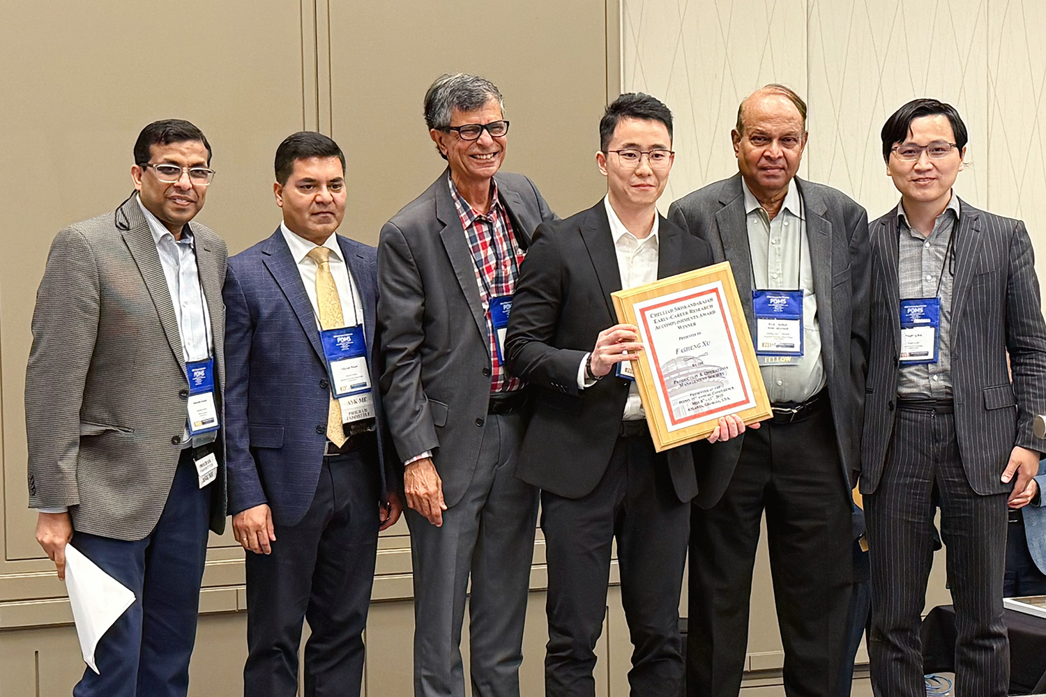 Professor Fasheng Yu accepting the 2025 Chelliah Sriskandarajah Early Career Research Accomplishments Award at the POMS Annual conference (contributed photo)