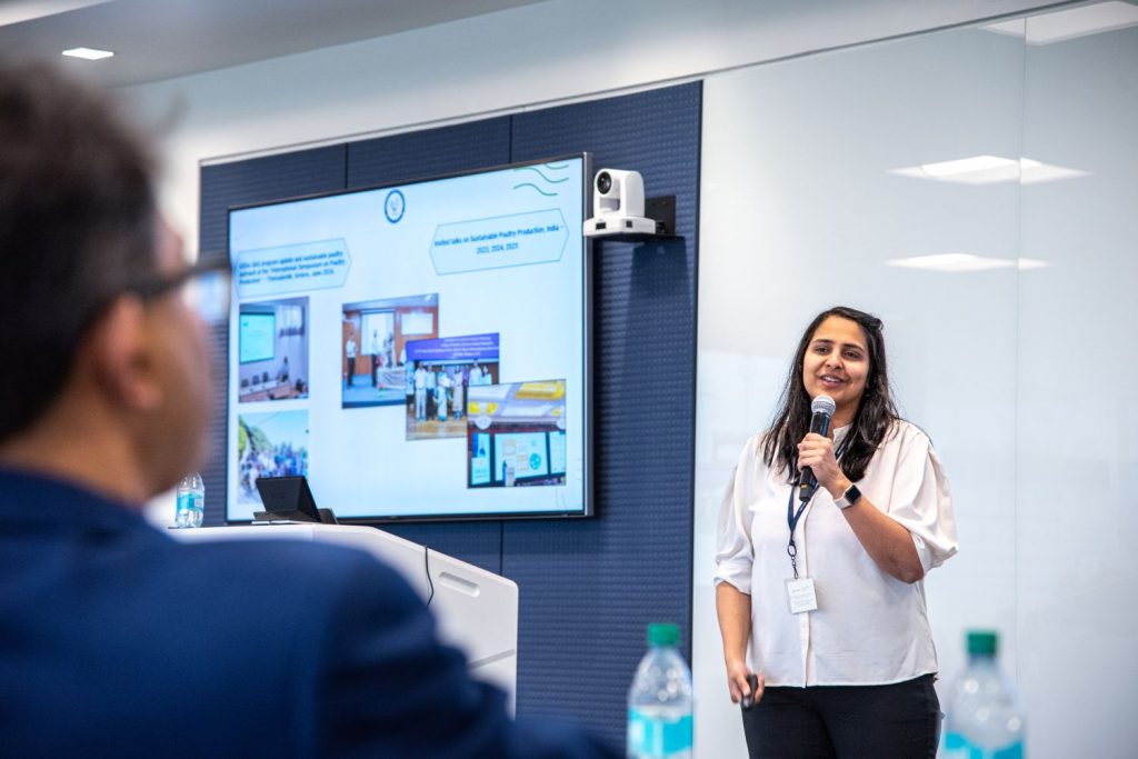 Woman speaking in front of a meeting