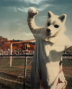 Jonathan the Husky mascot poses at a soccer game