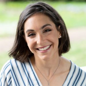 Photo of a woman with short hair and a striped shirt