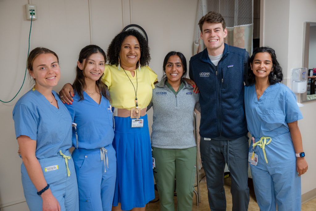 UConn medical schools Cassandra Keola with fourth-year medical students. 