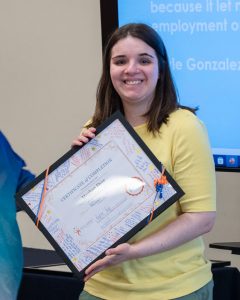 portrait woman holding certificate