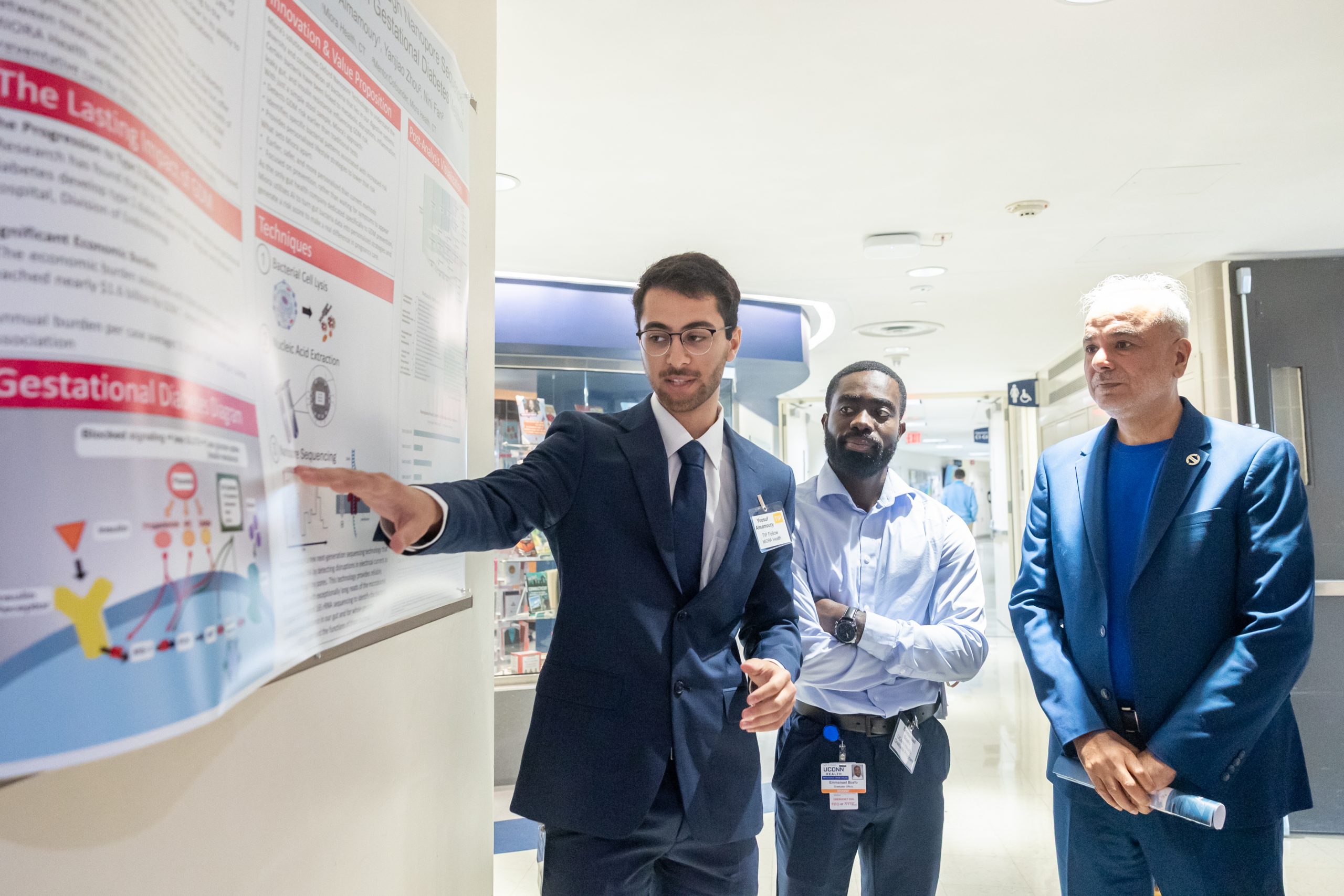 Student researcher showing research project
