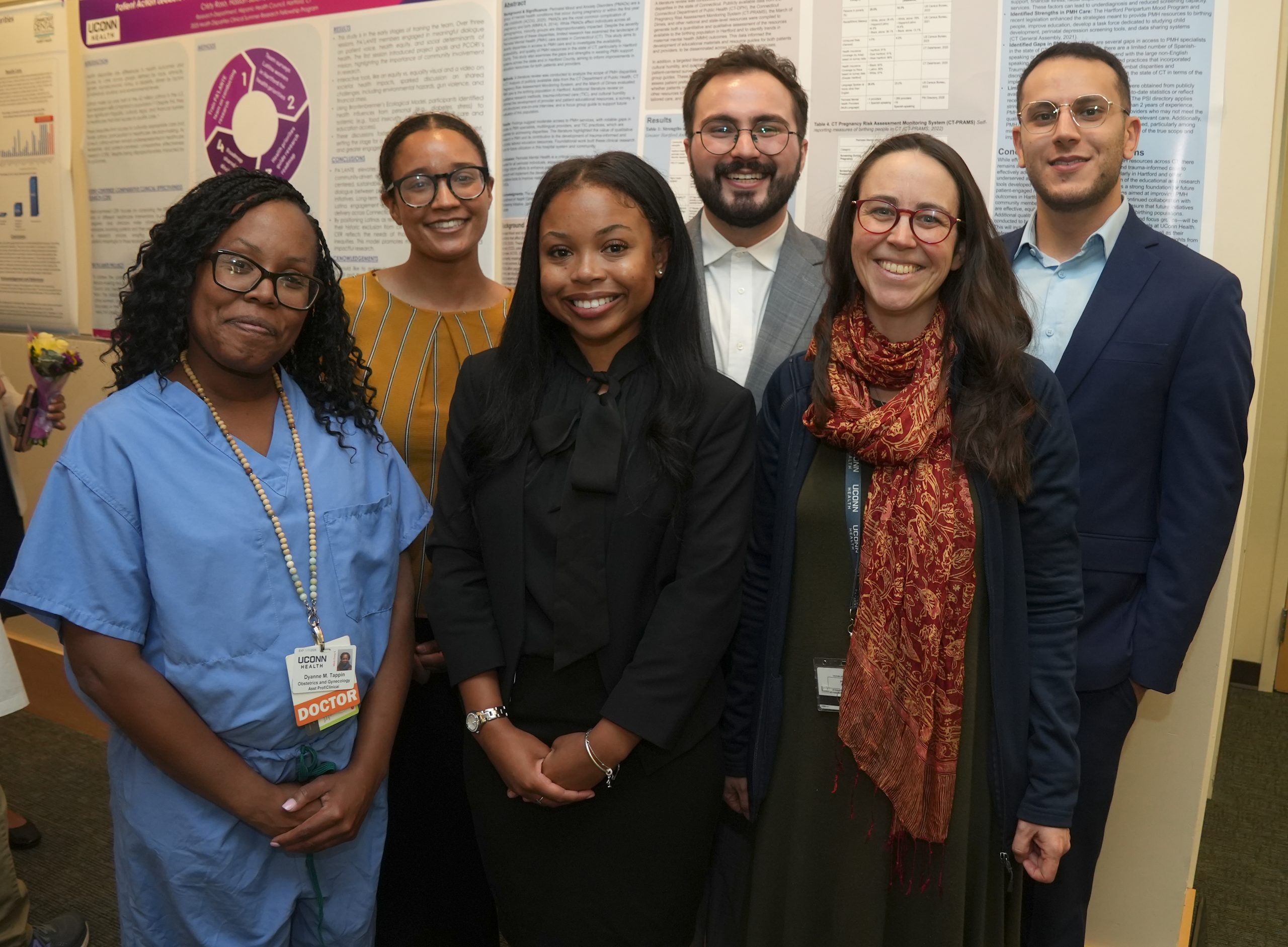 Four incoming Class of 2029 UConn medical students celebrating their exciting preview to UConn Health thanks to their summer research experience including Bria Slater (center-front row), and (back row) Sophia Fernandes, Christopher Morales, and Dany Skaf with some of their dedicated UConn Health faculty mentors OB/GYN Dr. Dyanne Tappin (left front) and Nueroscientist Alice Burghard (front right). (John Atashian Photo/ UConn Health - July 17, 2025).