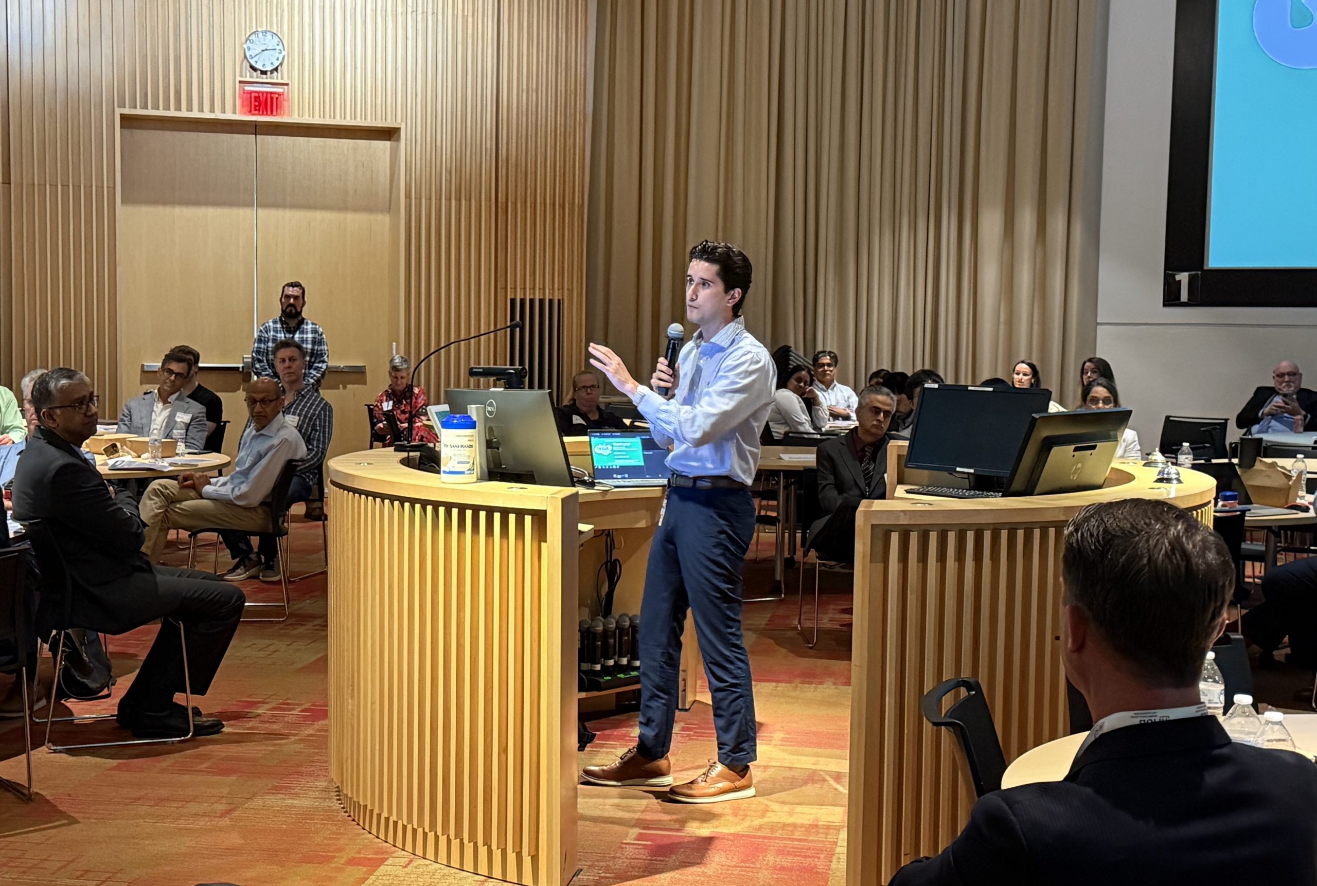 Class of 2027 UConn dental student Marcus A. Costa talking to investors about his healthy chewing gum invention. (Photo by Lauren Woods)