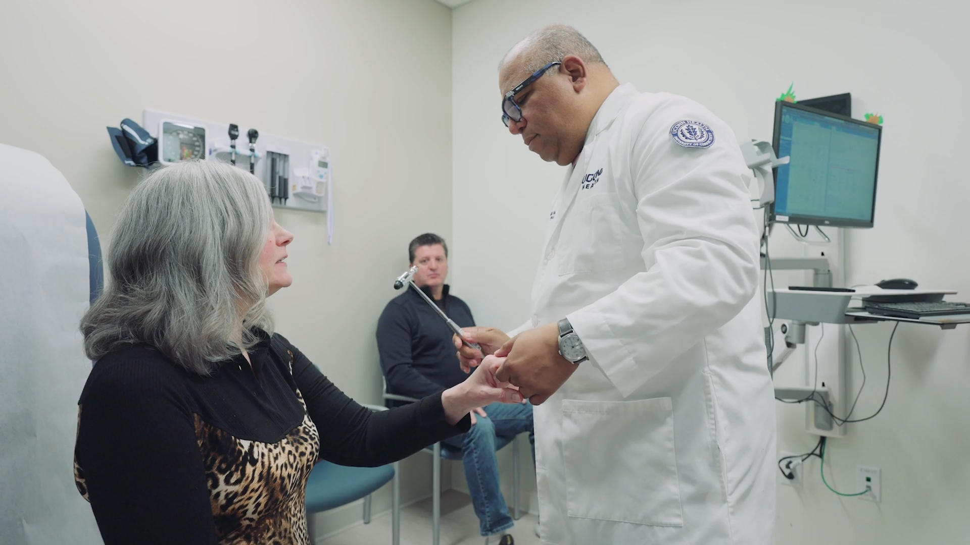 Patient being examined by a doctor in a white coat