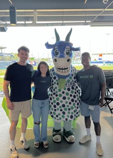 UConn medical students Riley and Lila Medeiros (left) attending a NEDS community outreach event at the Hartford Yard Goats with Andrew Jones.