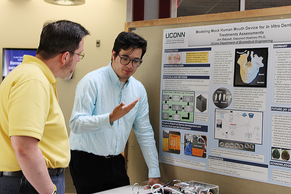 Jon Balyeat presents his project to Daniel Burkey.