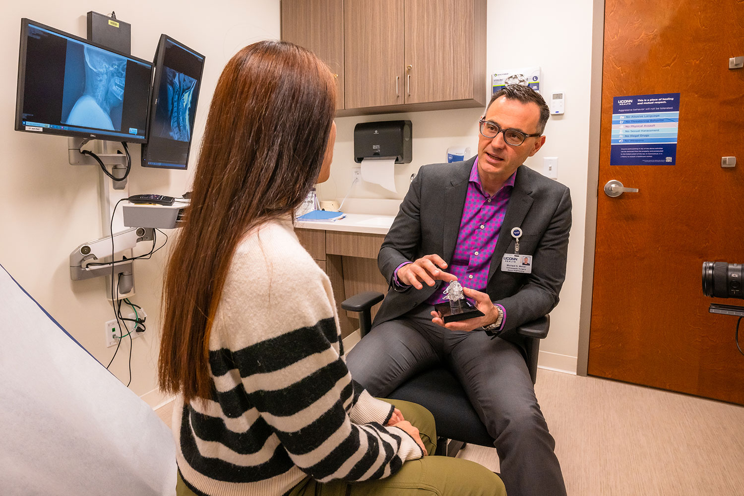 Dr. Michael Weber with patient in exam room