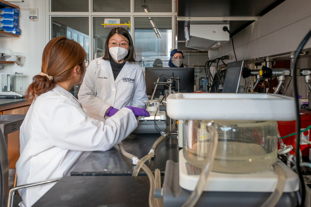 Assistant Professor of Pharmaceutics, Na Li working with her graduate students in her lab at the School of Pharmacy. Jan. 24, 2022. (Sean Flynn)