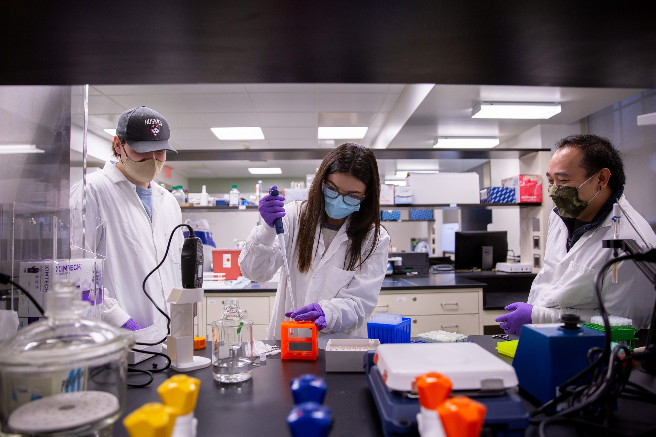 Olivia Vanegas, a behavioral neuroscience Ph.D. student in the Department of Psychological Sciences, conducts a laboratory training with fellow psych Ph.D. students Carl Rodriguez and Antonio Matt Reck in the lab of Steven Kinsey, professor of nursing, in Beach Hall.