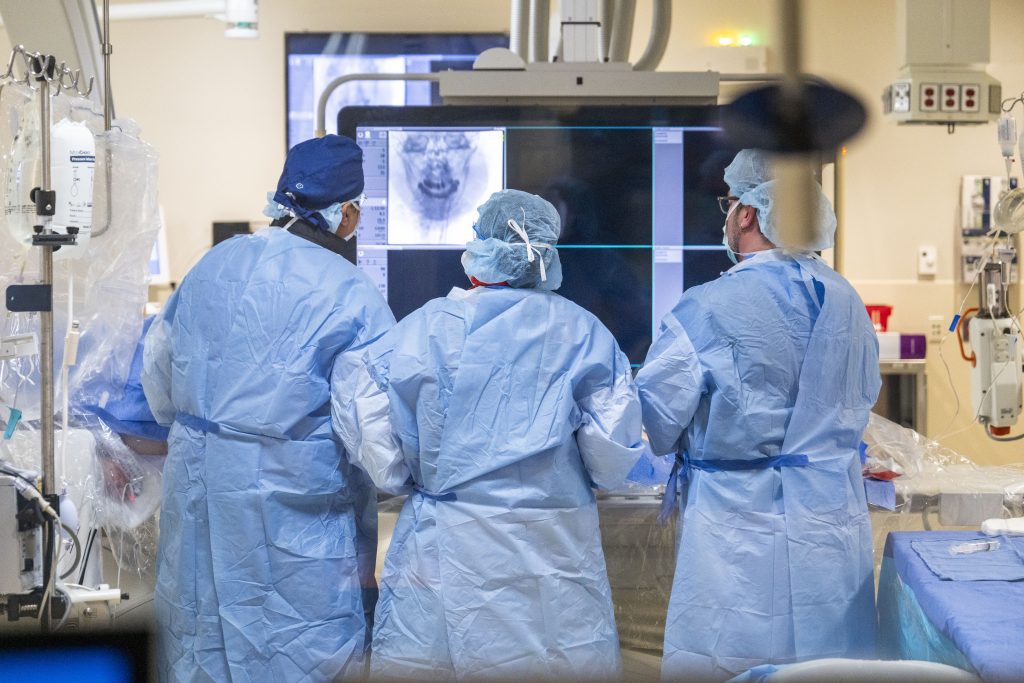 Dr. Taylor Burch (center) training at UConn with Chief Neurosurgeon Dr. Ketan Bulsara