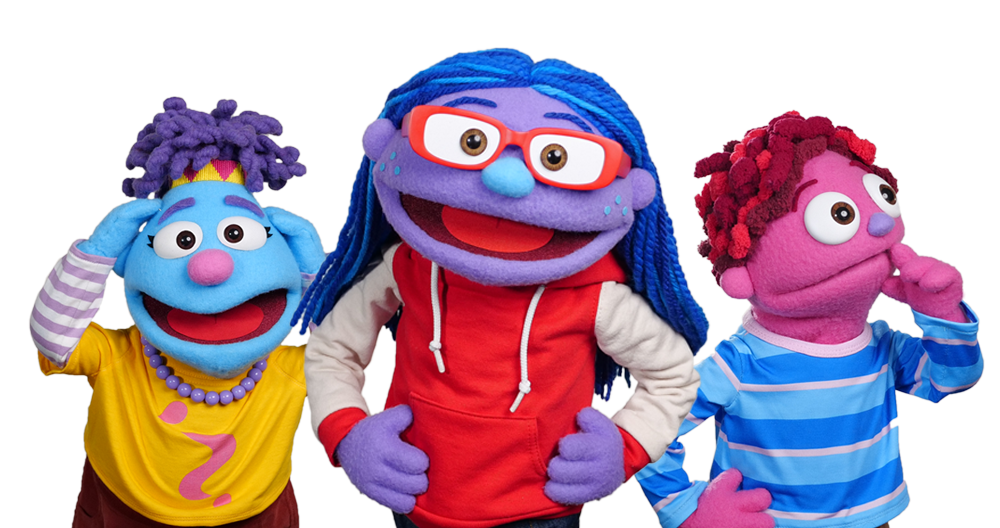 Three colorful puppet characters stand against a blue background, each with distinct hair, skin tones, and outfits expressing different emotions.