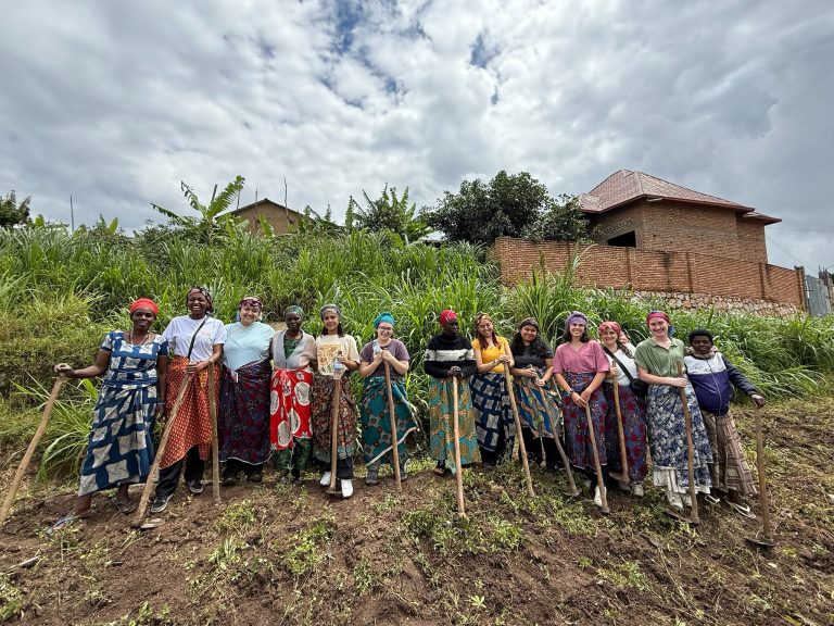 UConn School of Nursing students participate in 'a day in the life of a village woman' during the Experiential Global Learning Program in Rwanda.