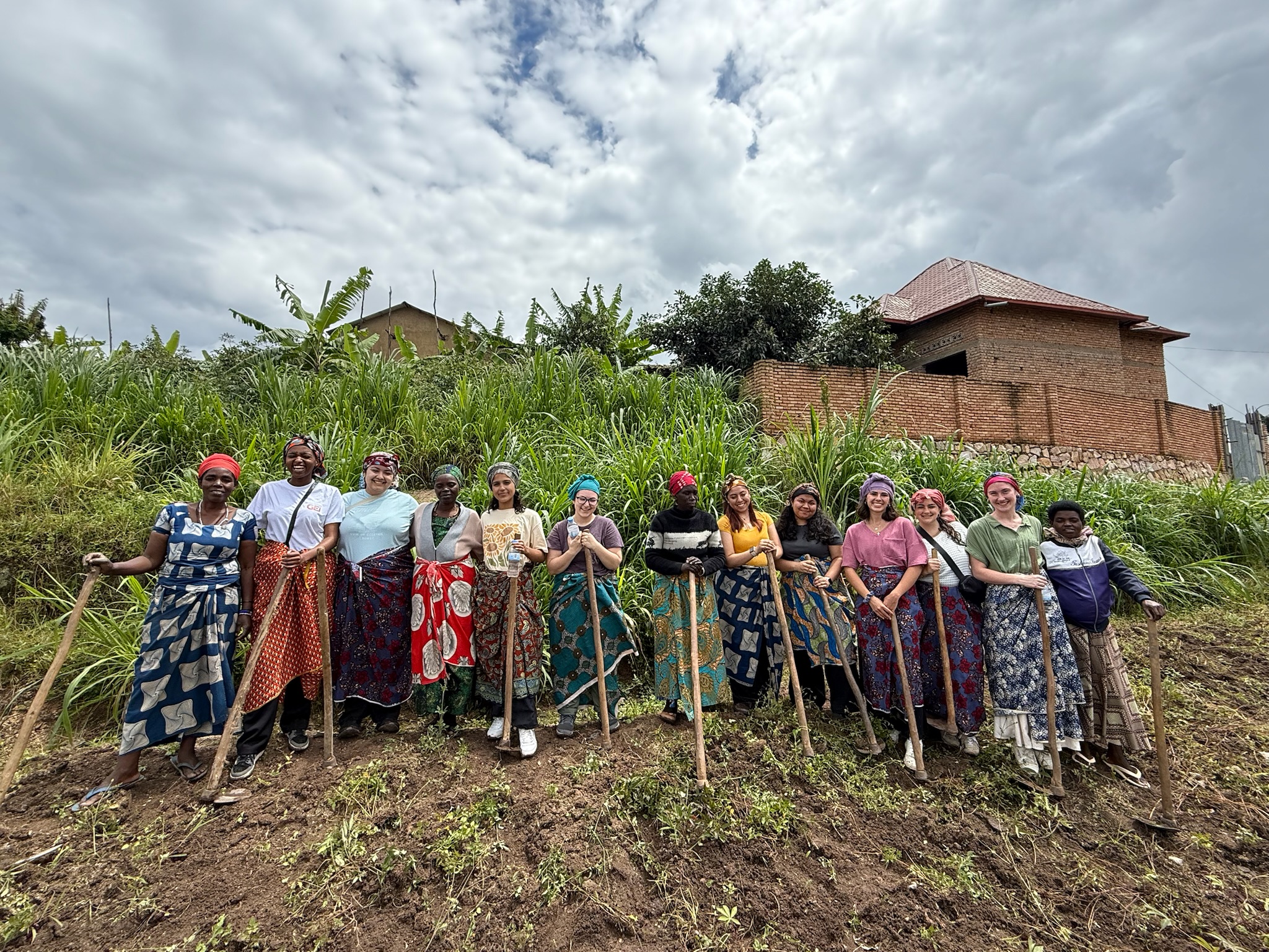 UConn School of Nursing students participate in 'a day in the life of a village woman' during the Experiential Global Learning Program in Rwanda.