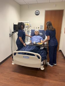 UConn School of Nursing students in the simulation lab with a high-fidelity mannequin on September 19, 2024. (Emily Laput)