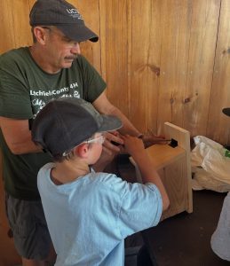 Bill Davenport, the UConn 4-H Litchfield County assistant extension educator and camp coordinator works with a youth camper