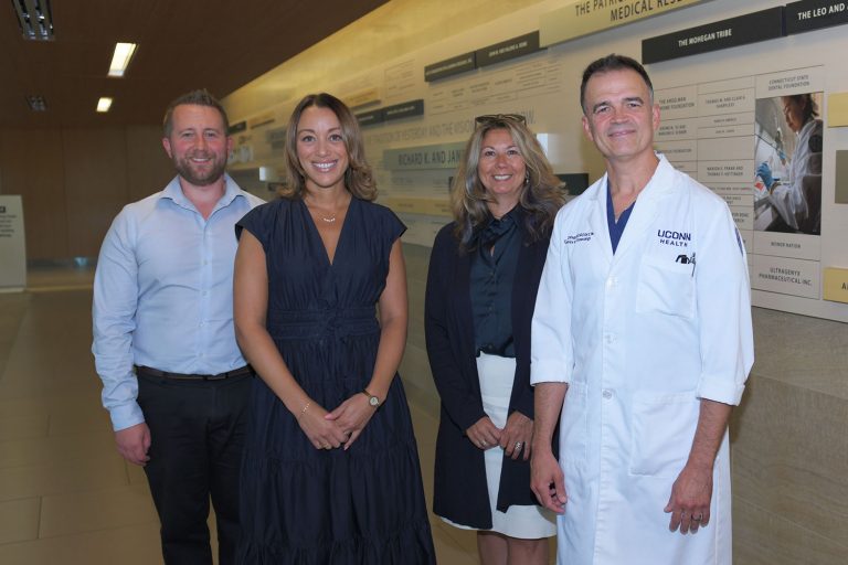 portrait of 4 indoors, male, female, female, male