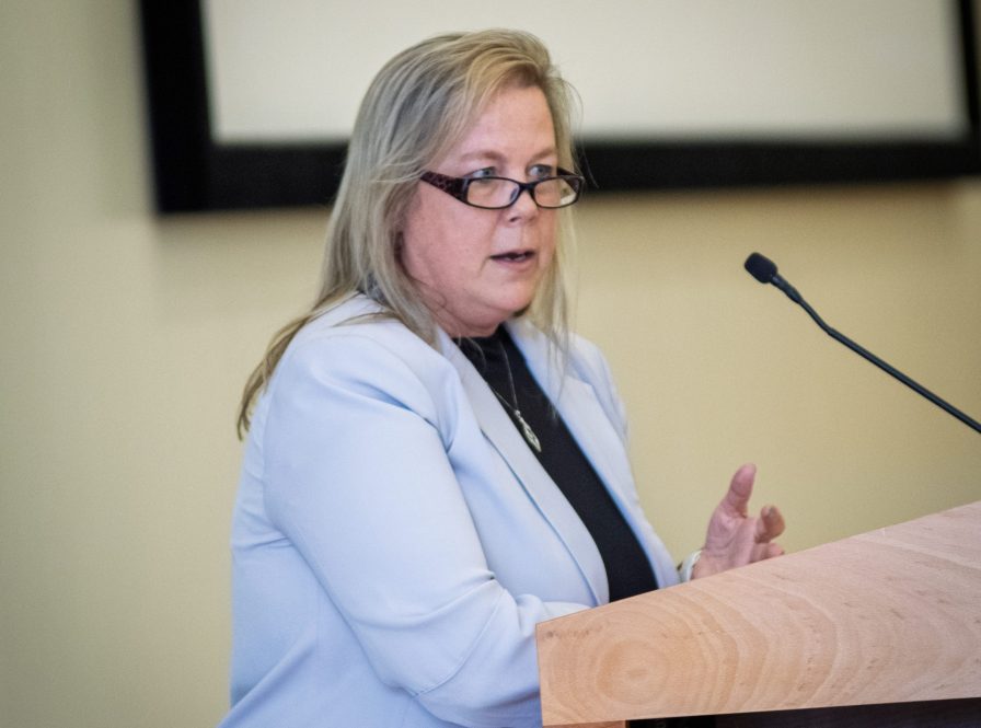Erika Lindeberg at a podium.