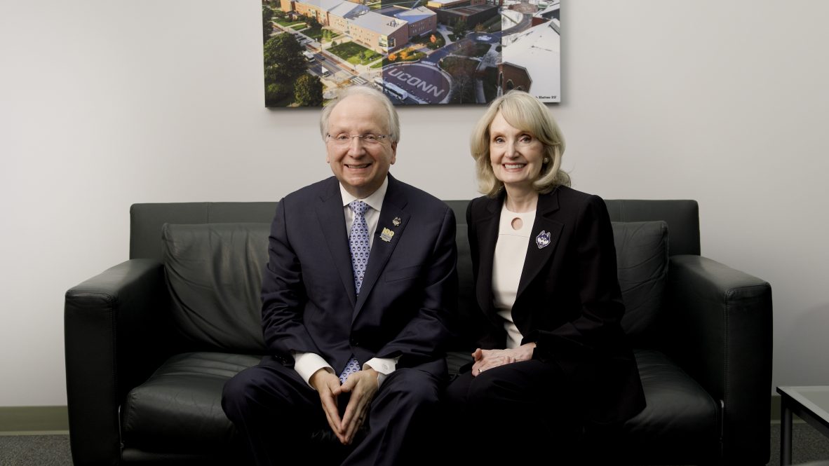 Phil and Lorraine Hritcko sitting together on a couch.