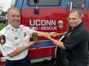 Fire Marshall Steve Garvin (left) presents a retirement gift to former Deputy Chief Mike Makuch.