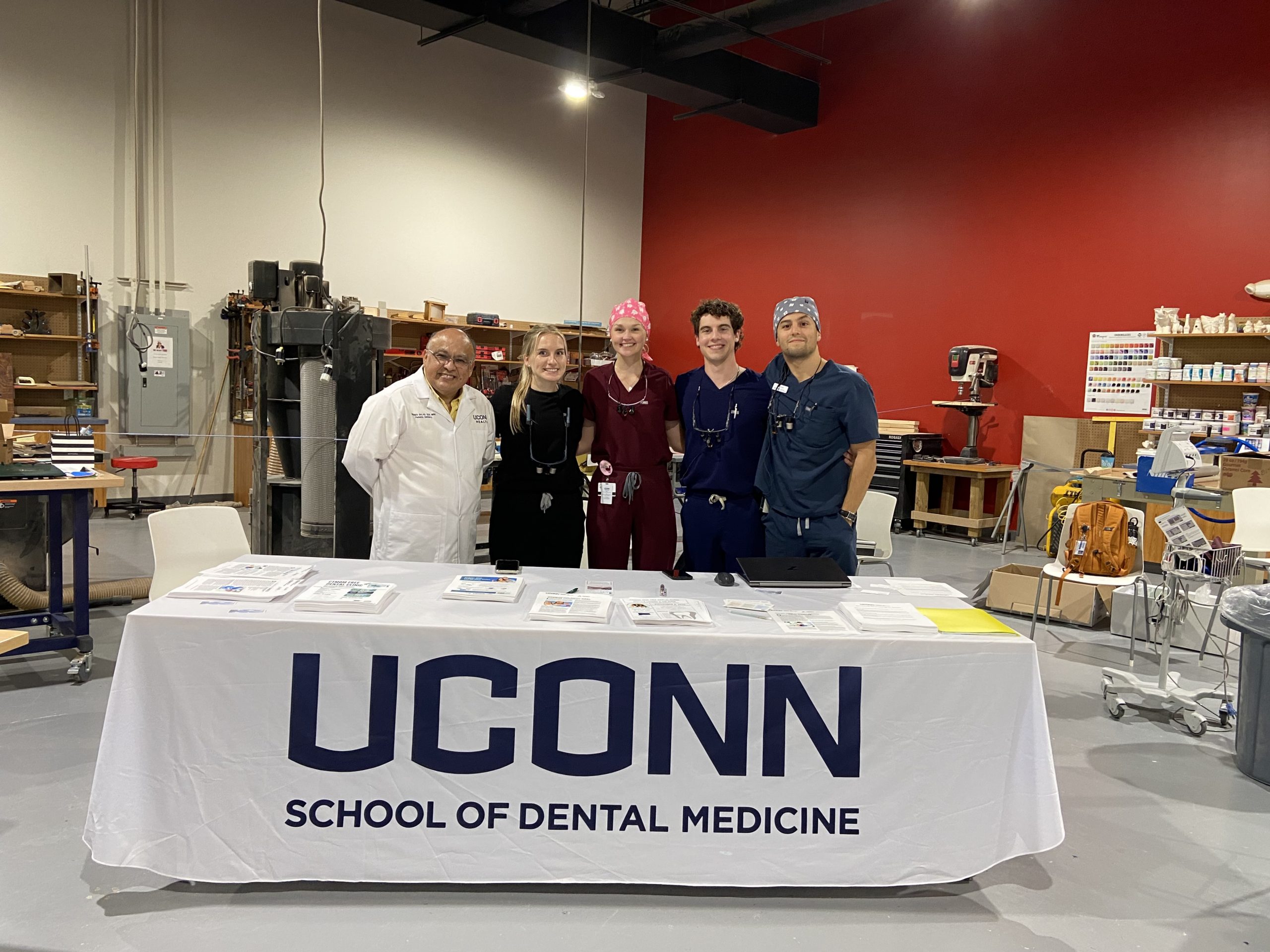 five dentists behind a table