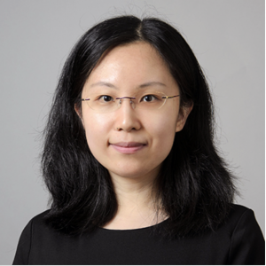 Headshot of a woman wearing glasses and a black shirt