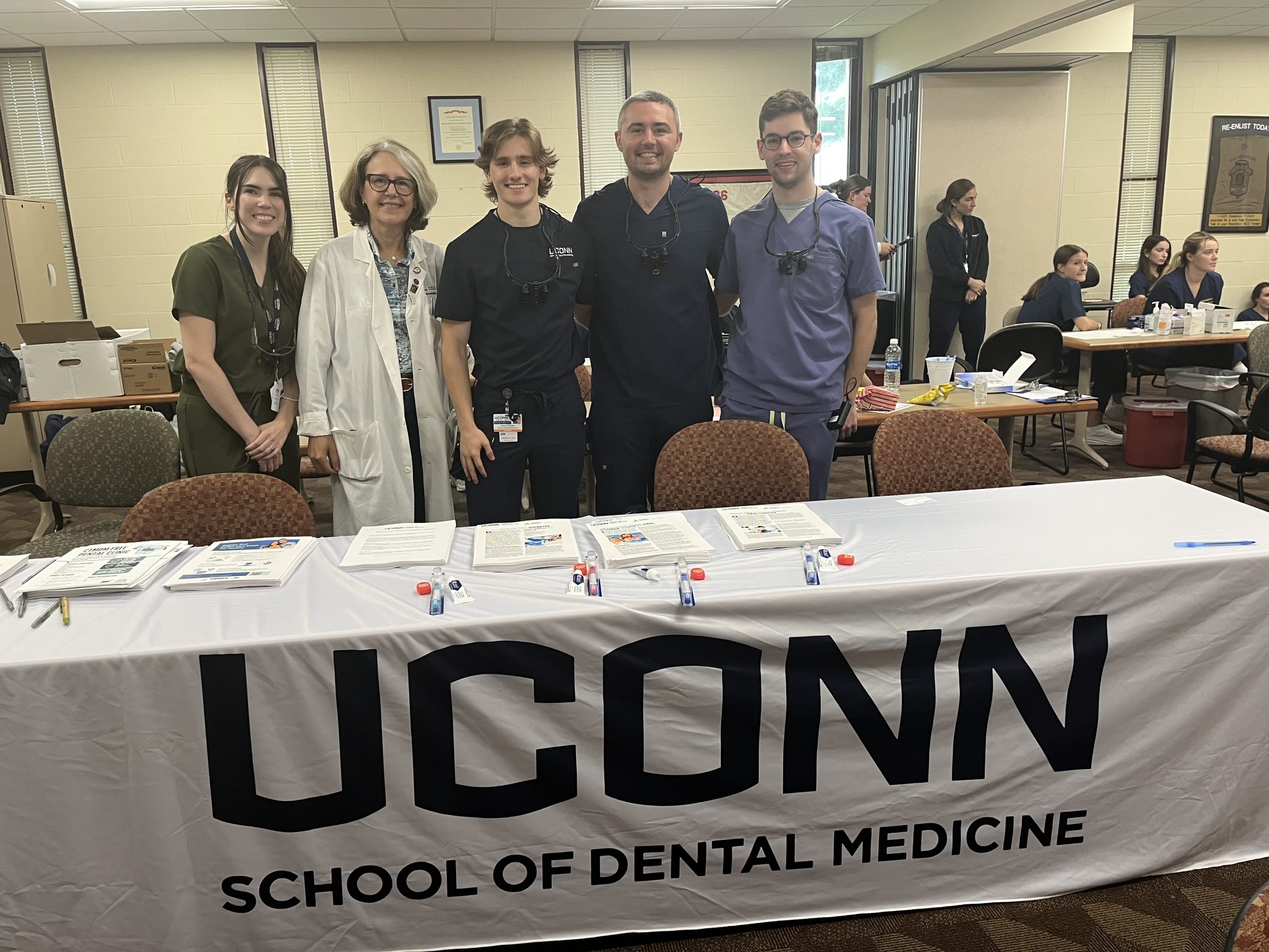five dentists behind a table