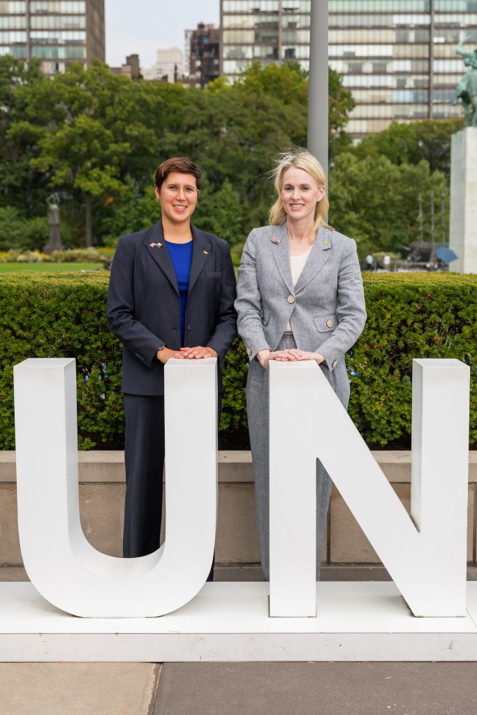 with UN sign UN event cohosts Dr. Georgia Lagoudas of Brown University School of Public Health and Professor Bronwyn King of the Burnet Institute of Melbourne, Australia.