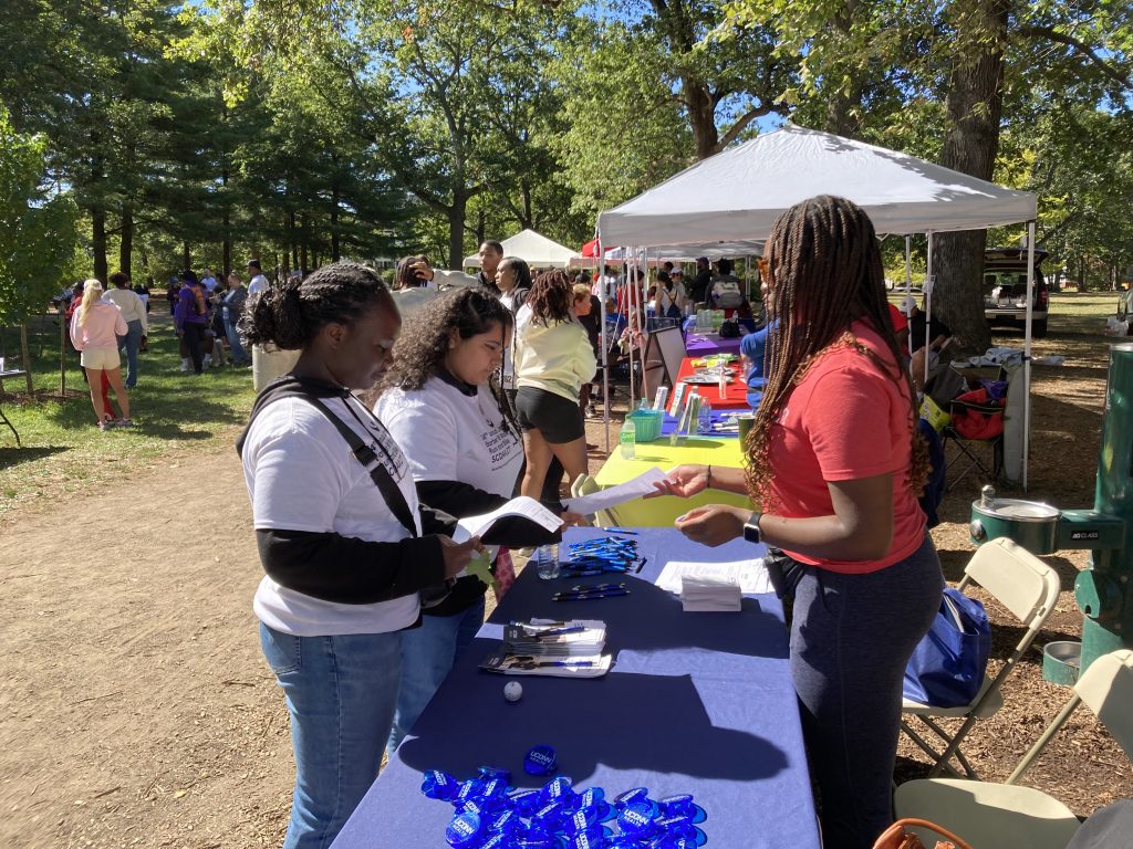 Zoe Green, clinical research assistant at info table.