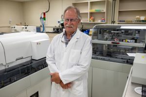 Sidney Hopfer environmental portrait in lab