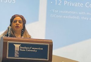 DMHAS/UConn Research Division Director Eleni Rodis at a podium