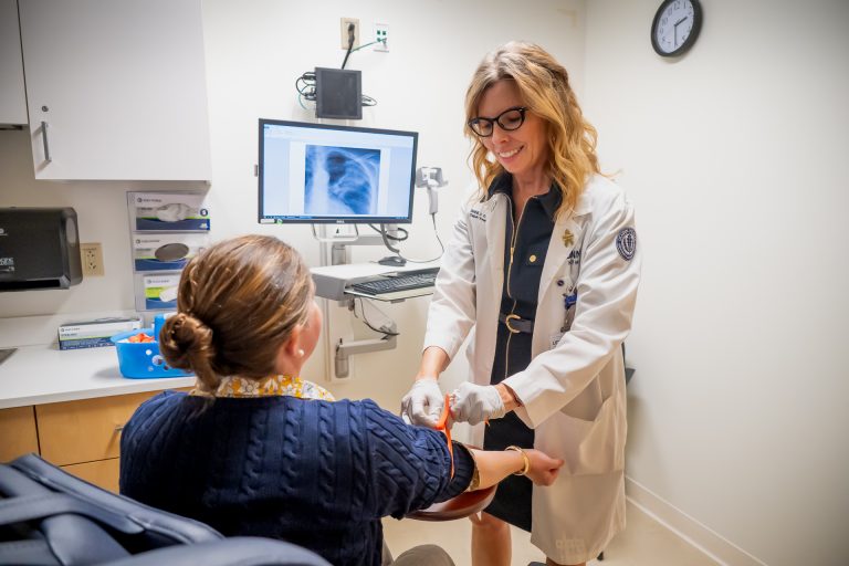 Study coordinator Sheila Thurlow, MSN, RN, at the Clinical Research Center examining a patient.