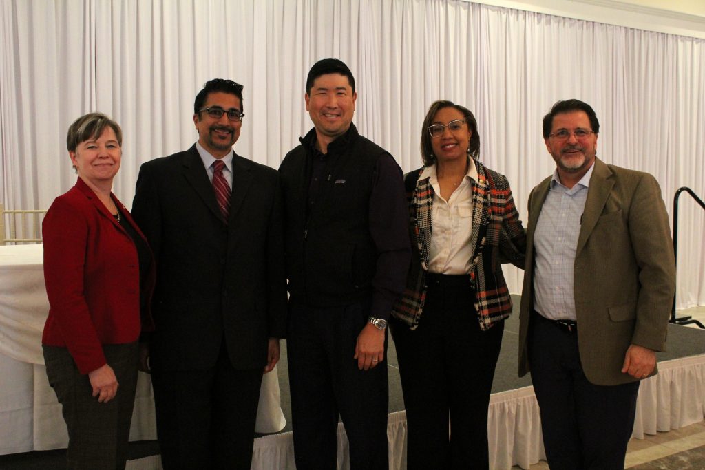 Chair of Family Medicine at UConn School of Medicine, Dr. Thomas Agresta (right) with the UConn School of Medicine alumni.