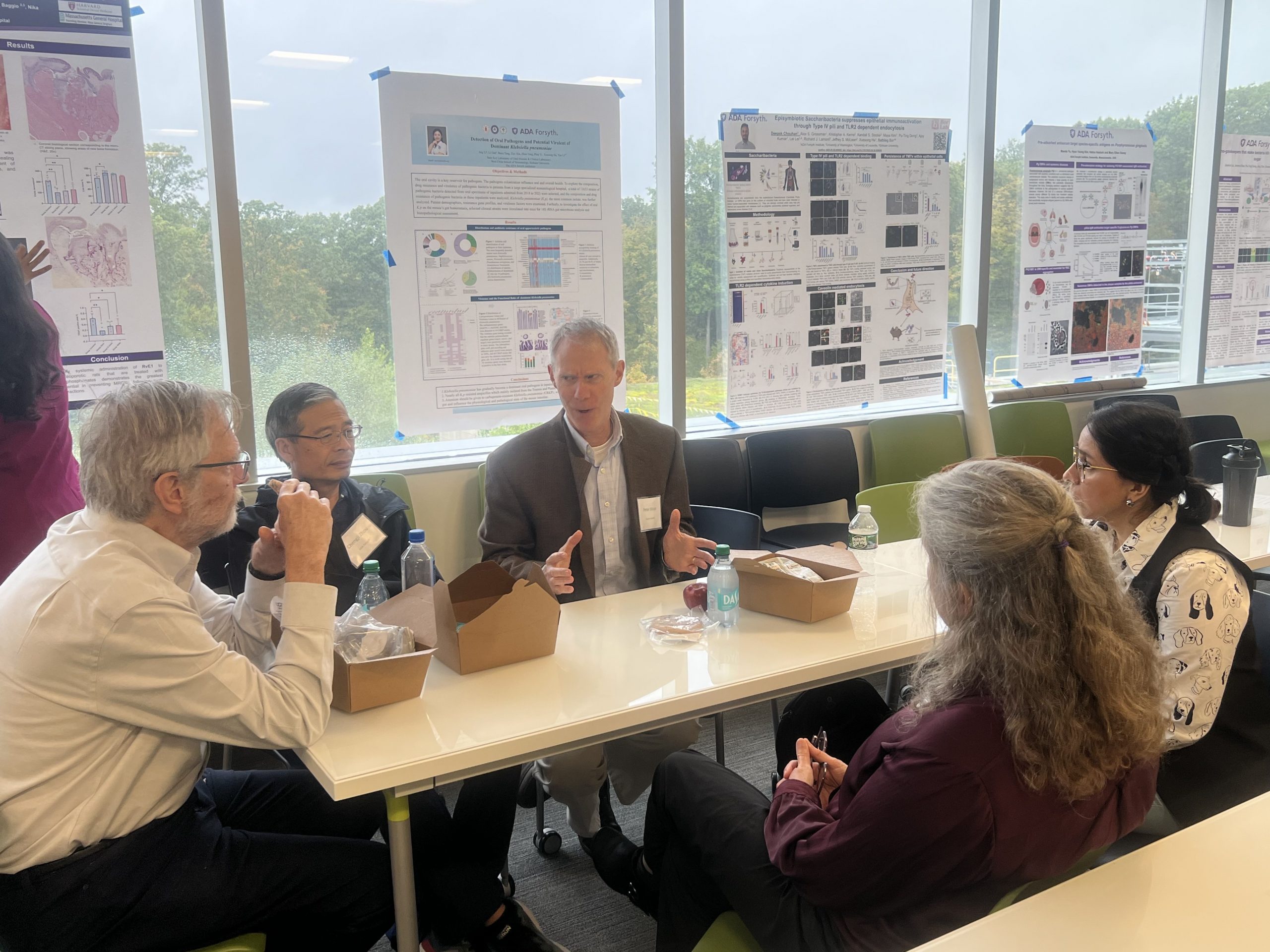 researchers sitting at table