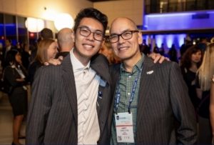 Ryan and his dad at a conference