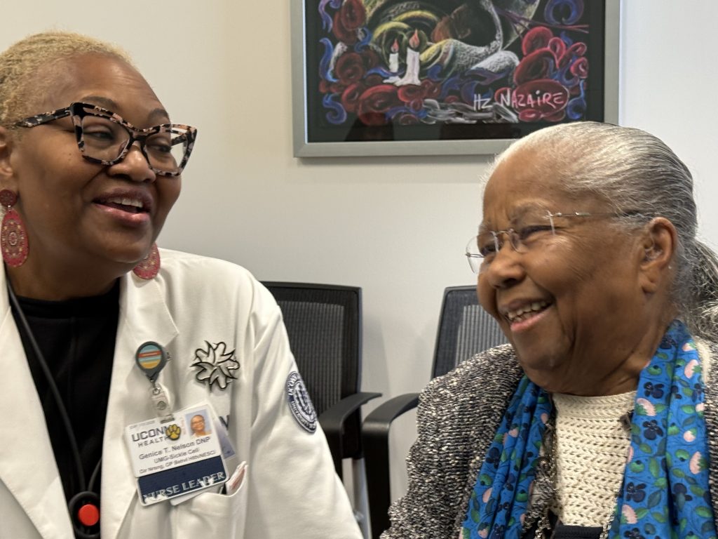 Dr Nelson and Jean laughing together at the Institute