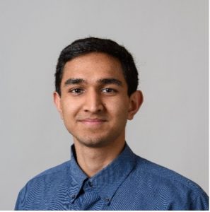 Headshot of a young man wearing a blue button-down shirt.