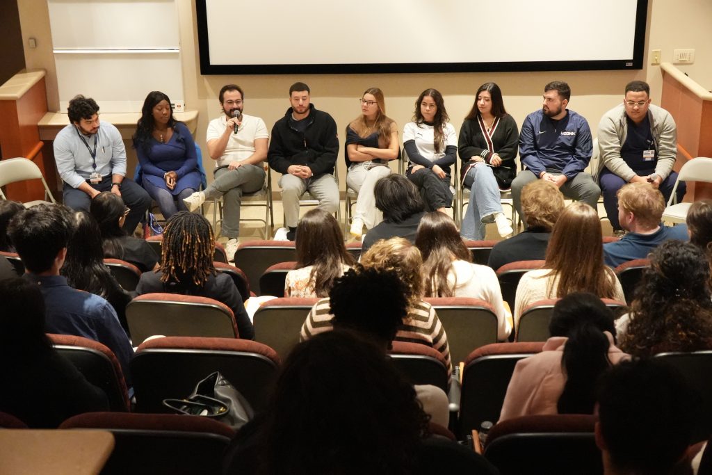 Students listening to panel discussion