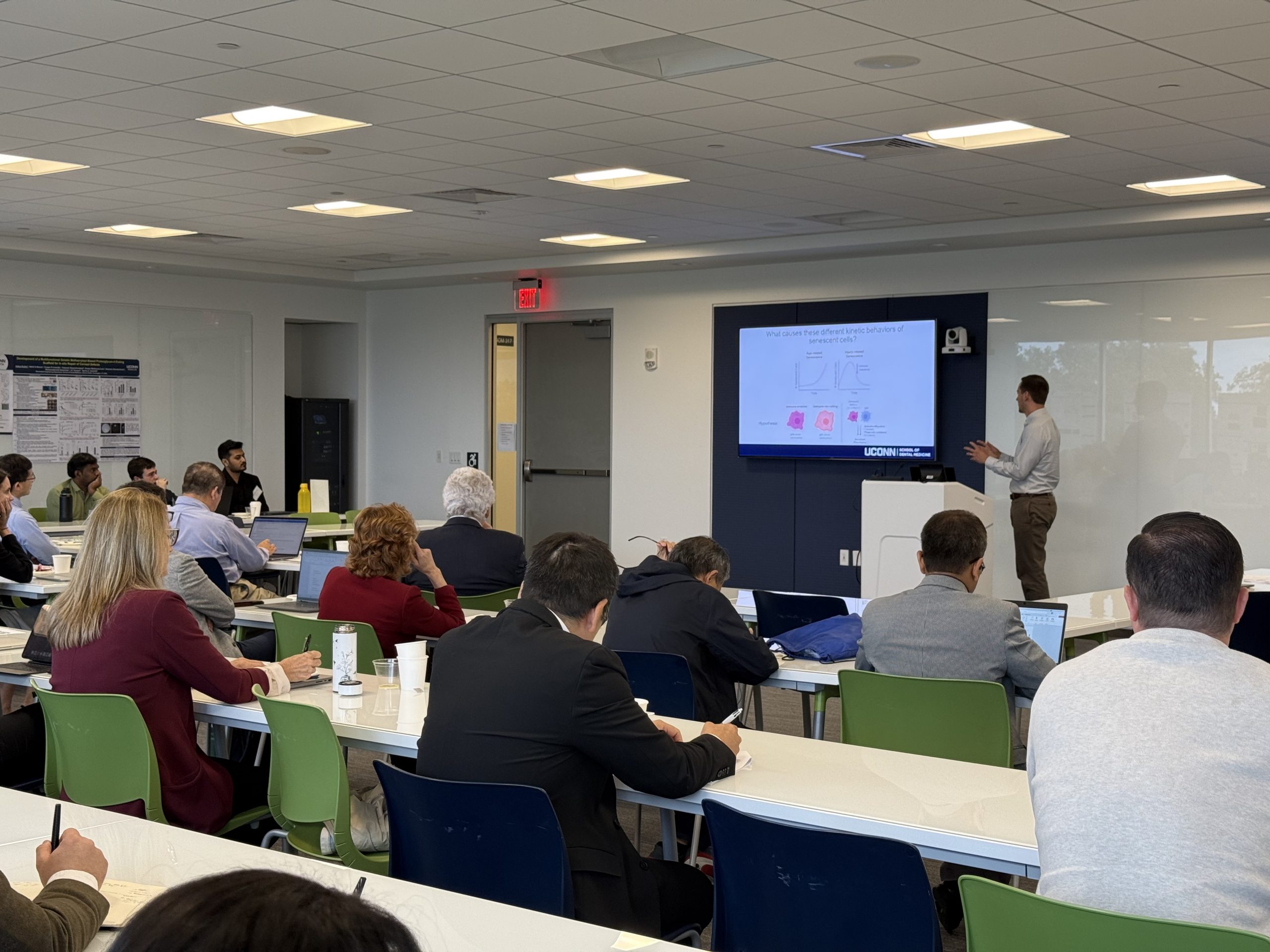MALE RESEARCHER GIVING PRESENTATION