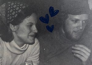 A man and woman smiling