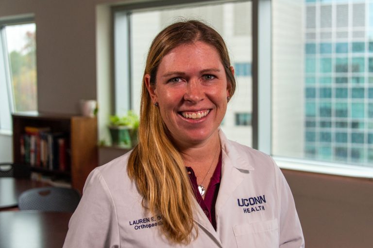 Dr. Lauren Geaney environmental portrait indoors white coat