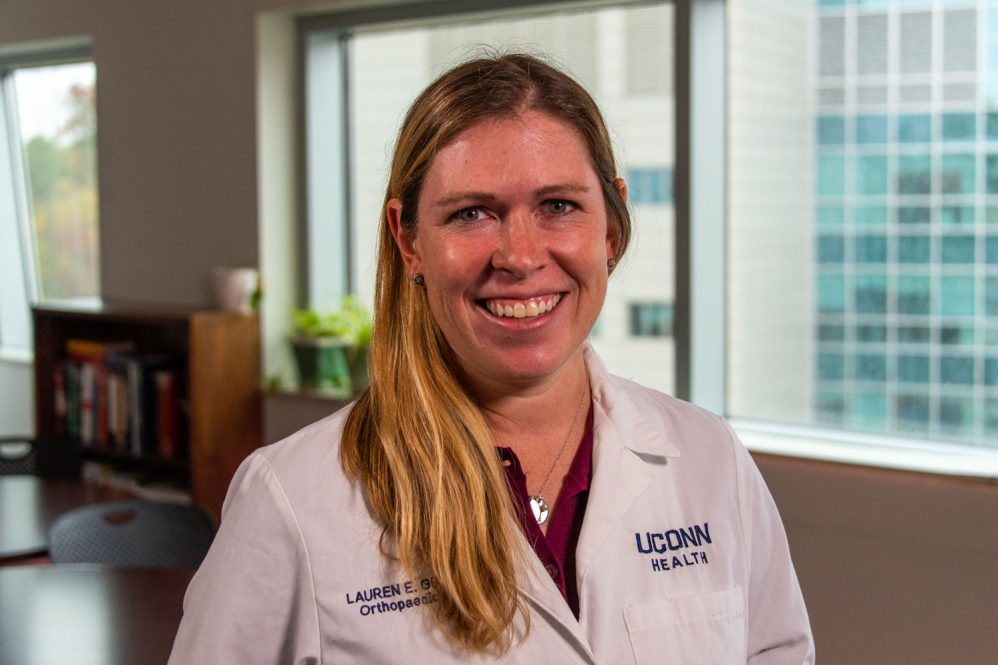 Dr. Lauren Geaney environmental portrait indoors white coat