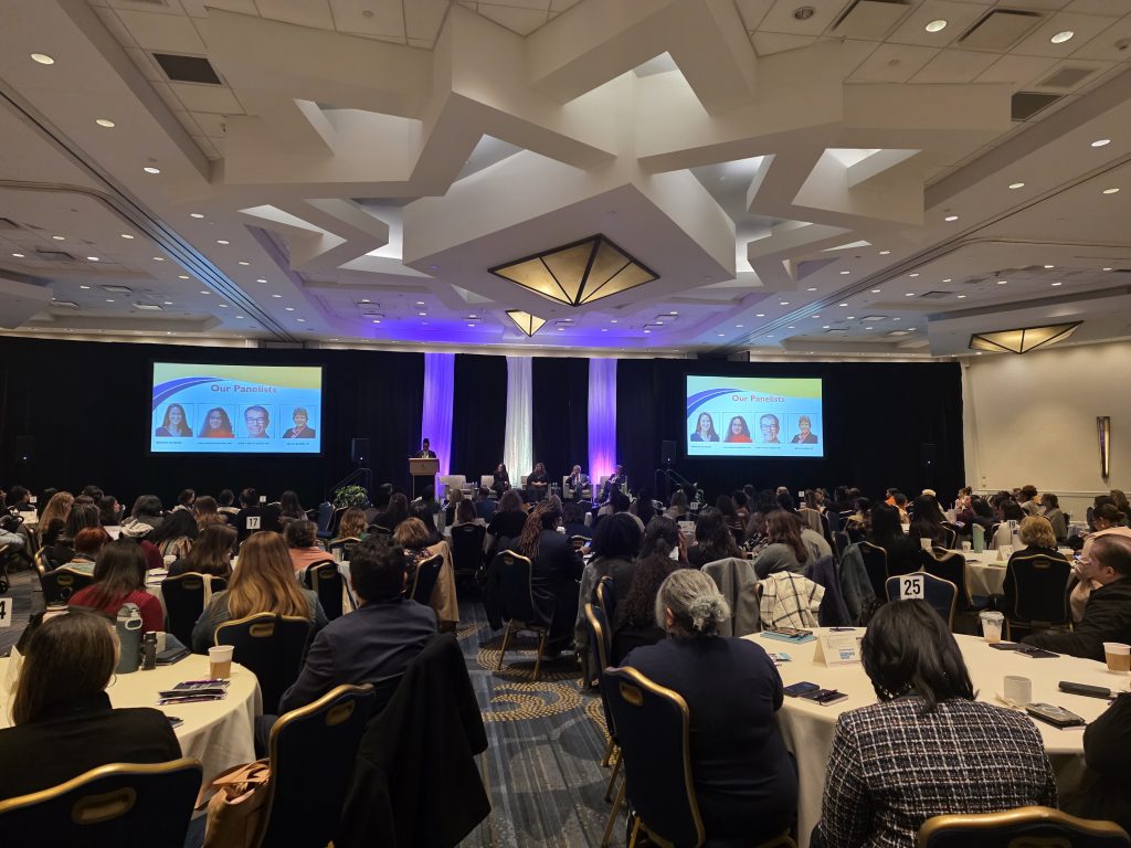 large room of audience at event.