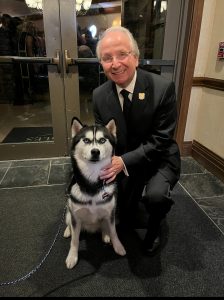 a man and a husky dog