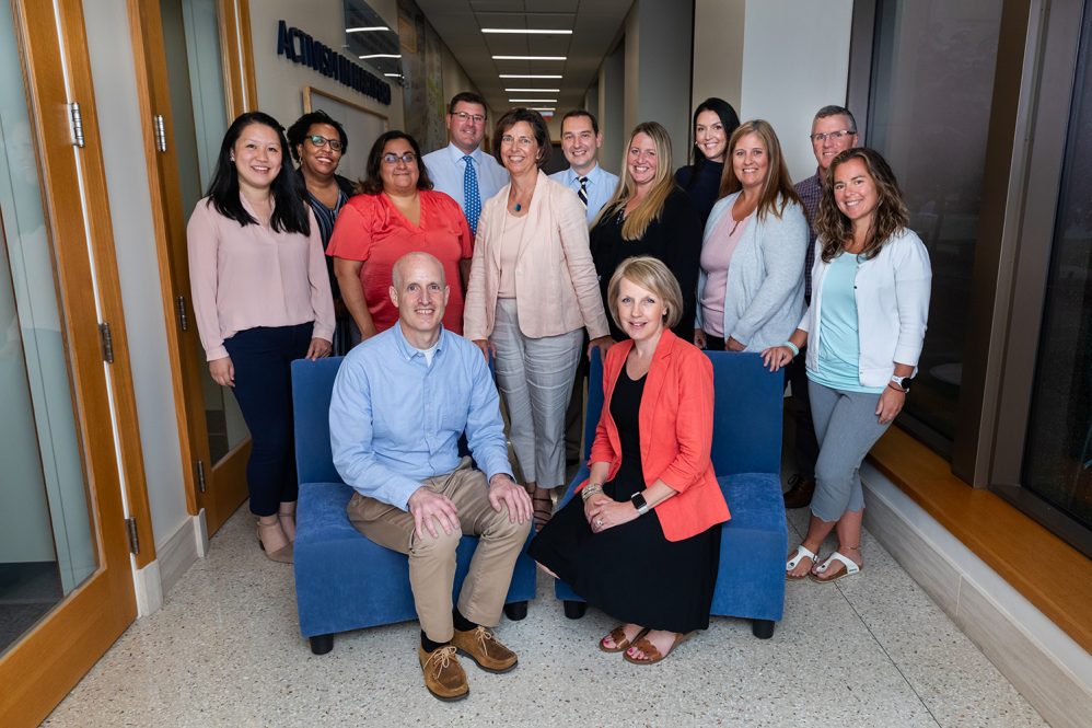 Group of professional adult students gather for a group photo.