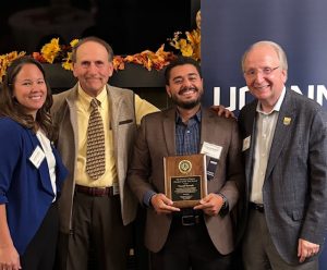 Youssef Bessada holding his award