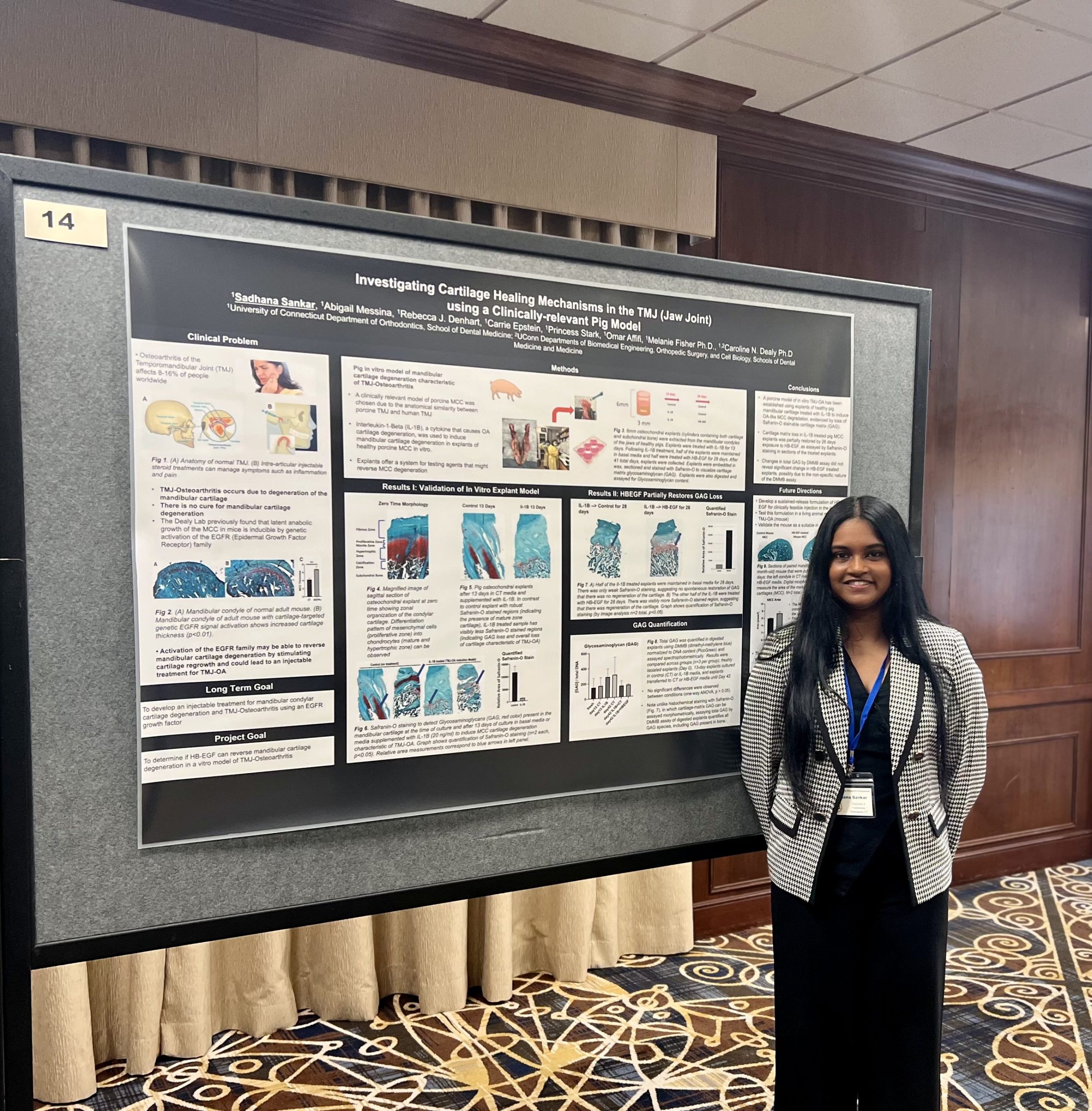 female student infront of research poster